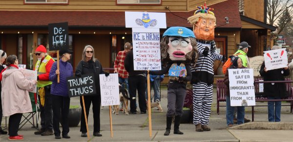 Line of protesters with signs